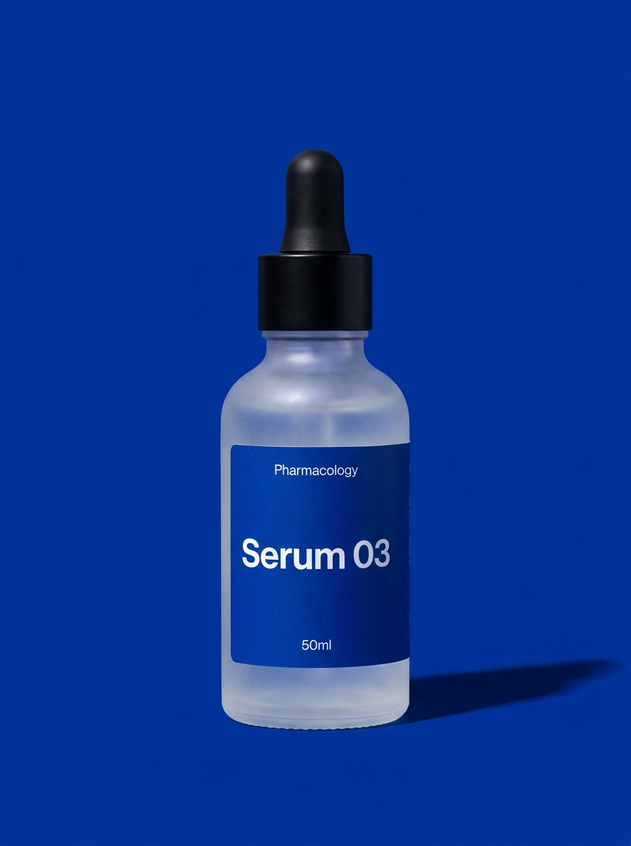 Pharmacology Serum 03 prototype — frosted glass dropper bottle with a klein-blue label